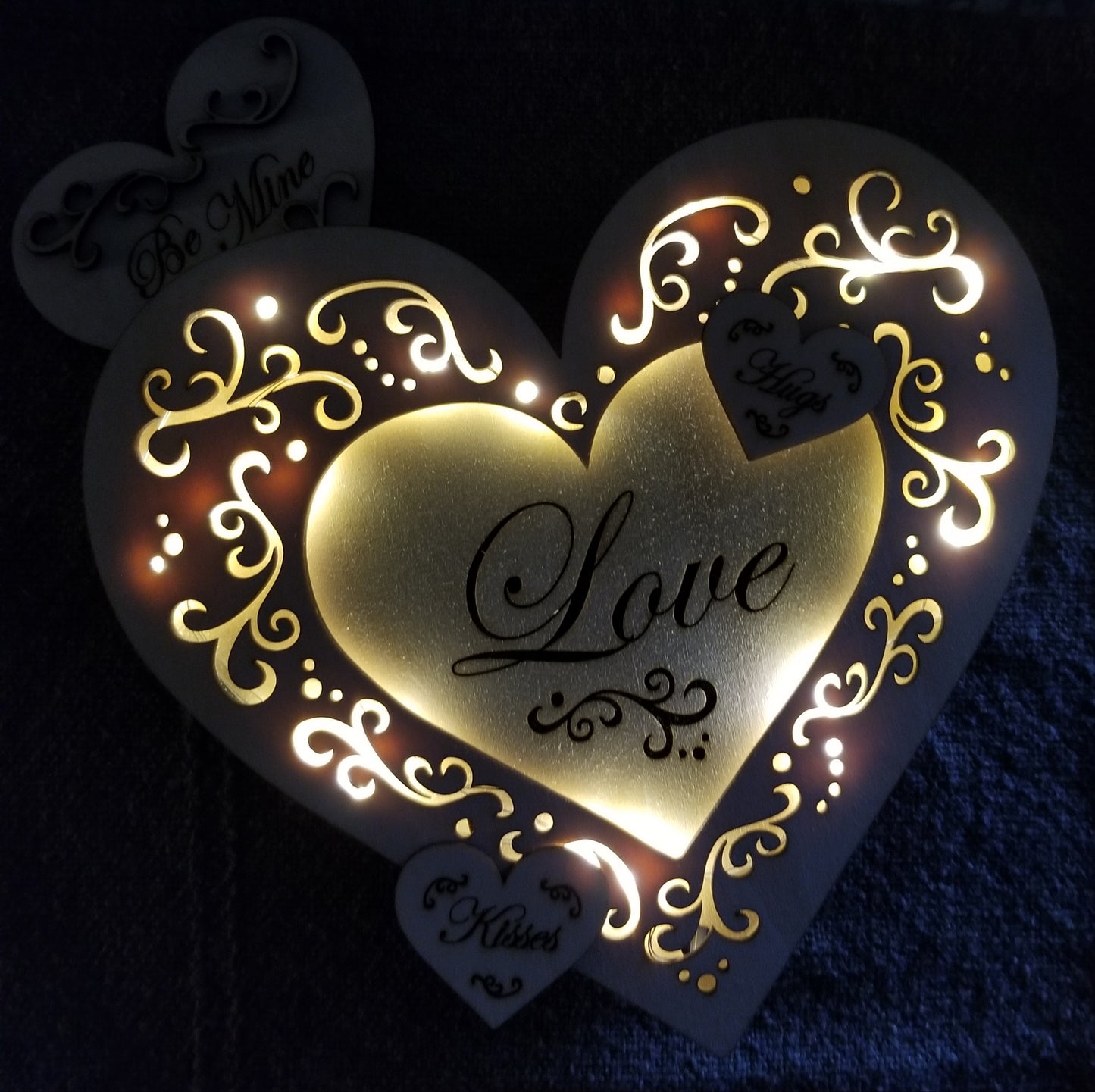 Layered "Love" conversation heart with filigree cuts and LED lights.