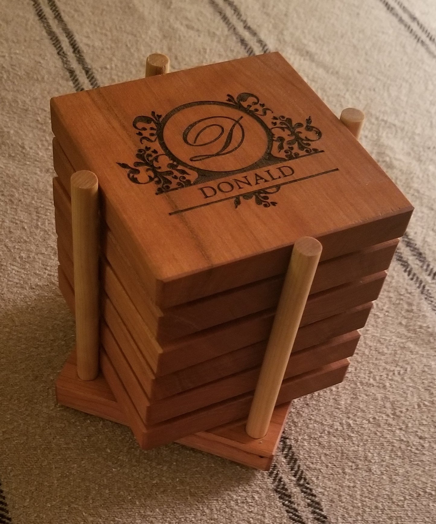 Custom engraved coasters with monogram letter and name. Custom engraved holder.