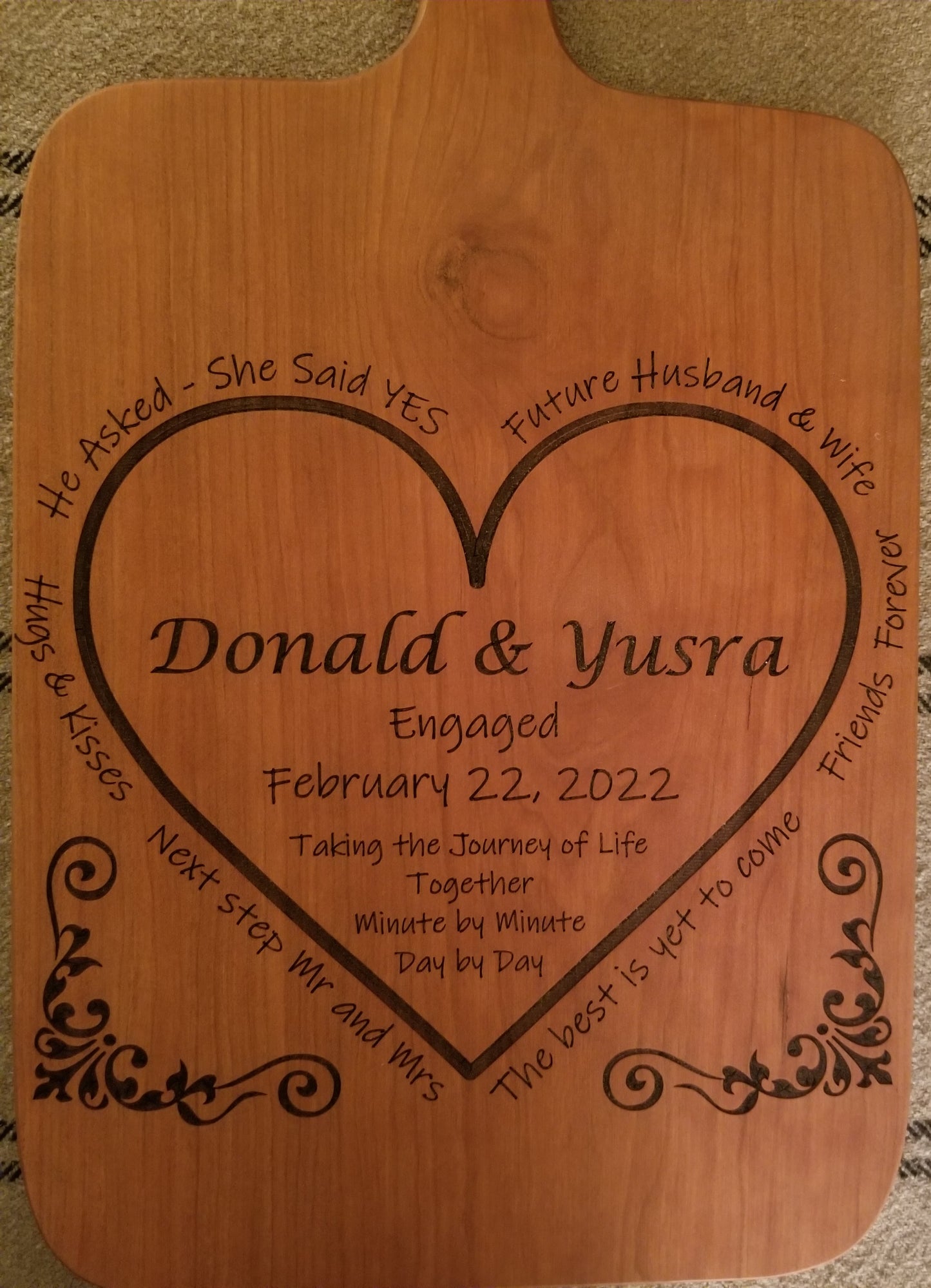 Custom engraved engagement cutting/serving board. Personalized with names, date and a special message. Shown in Cherry.