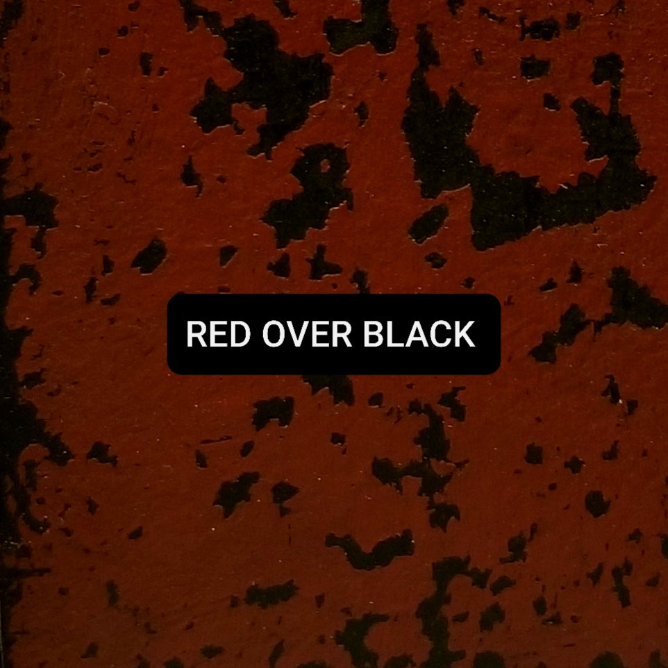 Paint swatch Red over Black, aged and distressed.
