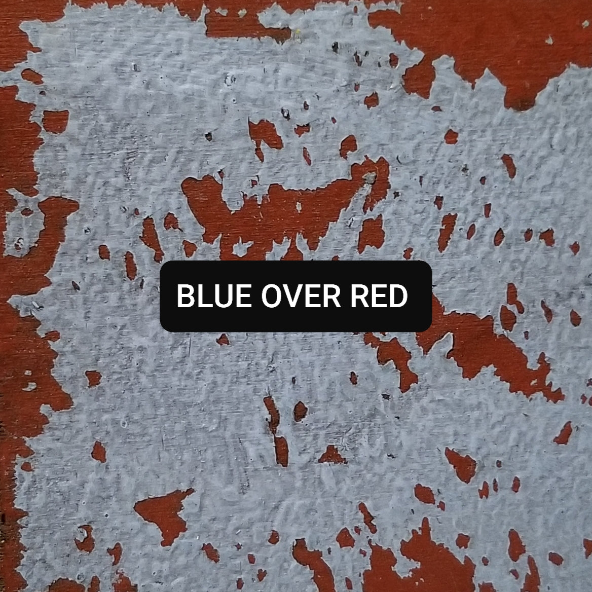 Paint swatch Blue over Red, aged and distressed.