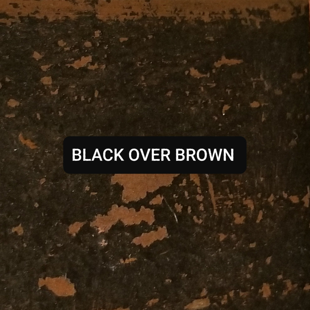 Paint swatch Black over Brown, aged and distressed.
