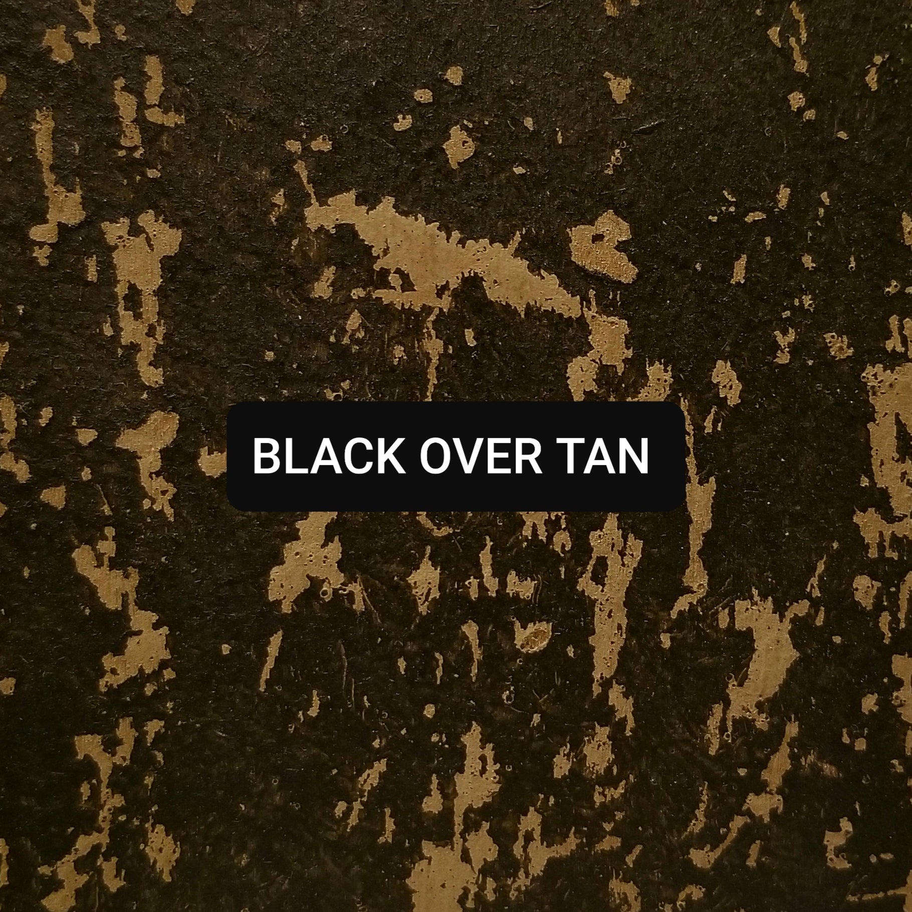 Paint swatch Black over Tan, aged and distressed.