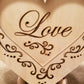"Love" conversation heart with filigree cuts and LED lights. 