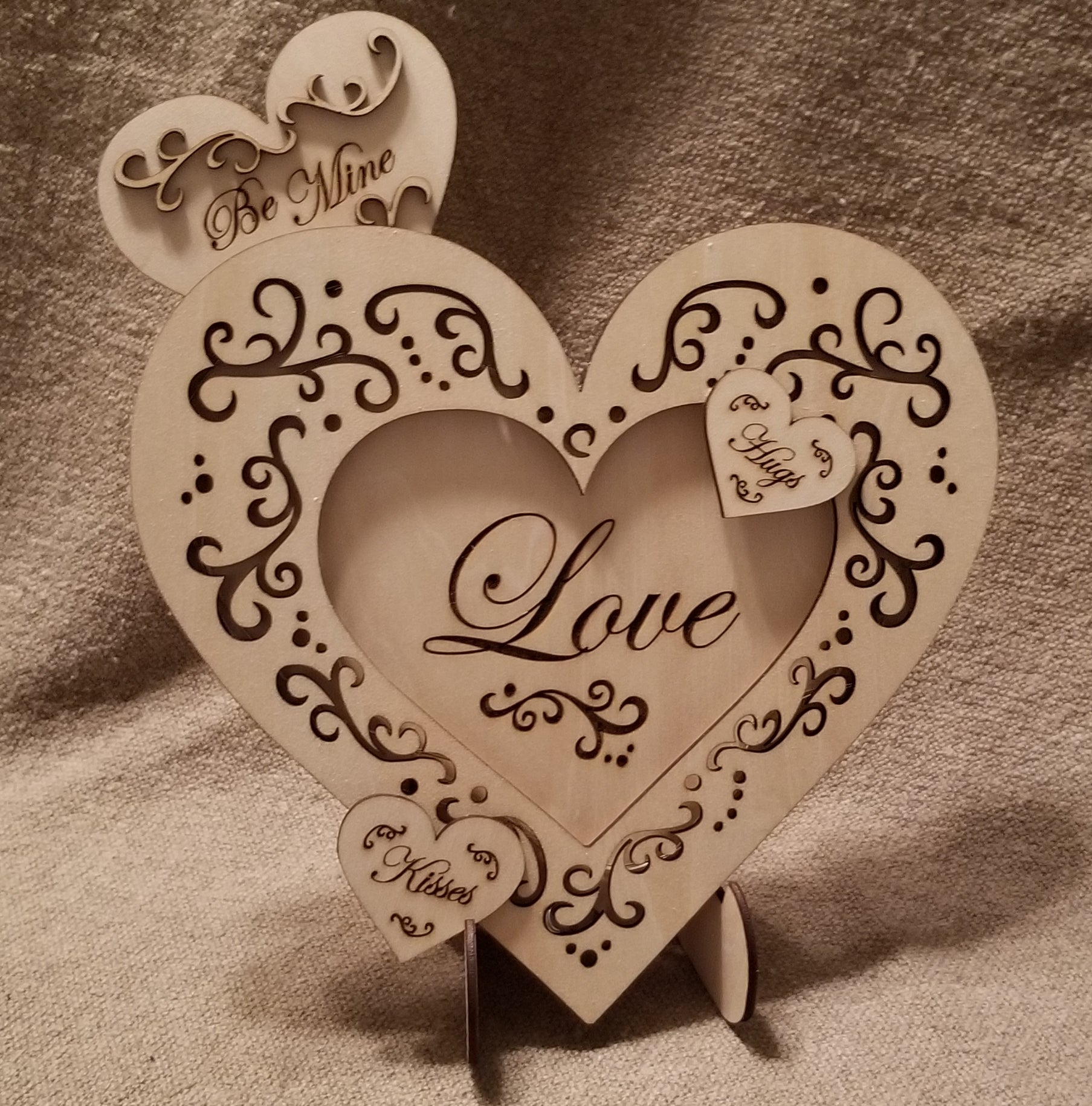 Layered "Love" conversation heart with filigree cuts and LED lights.