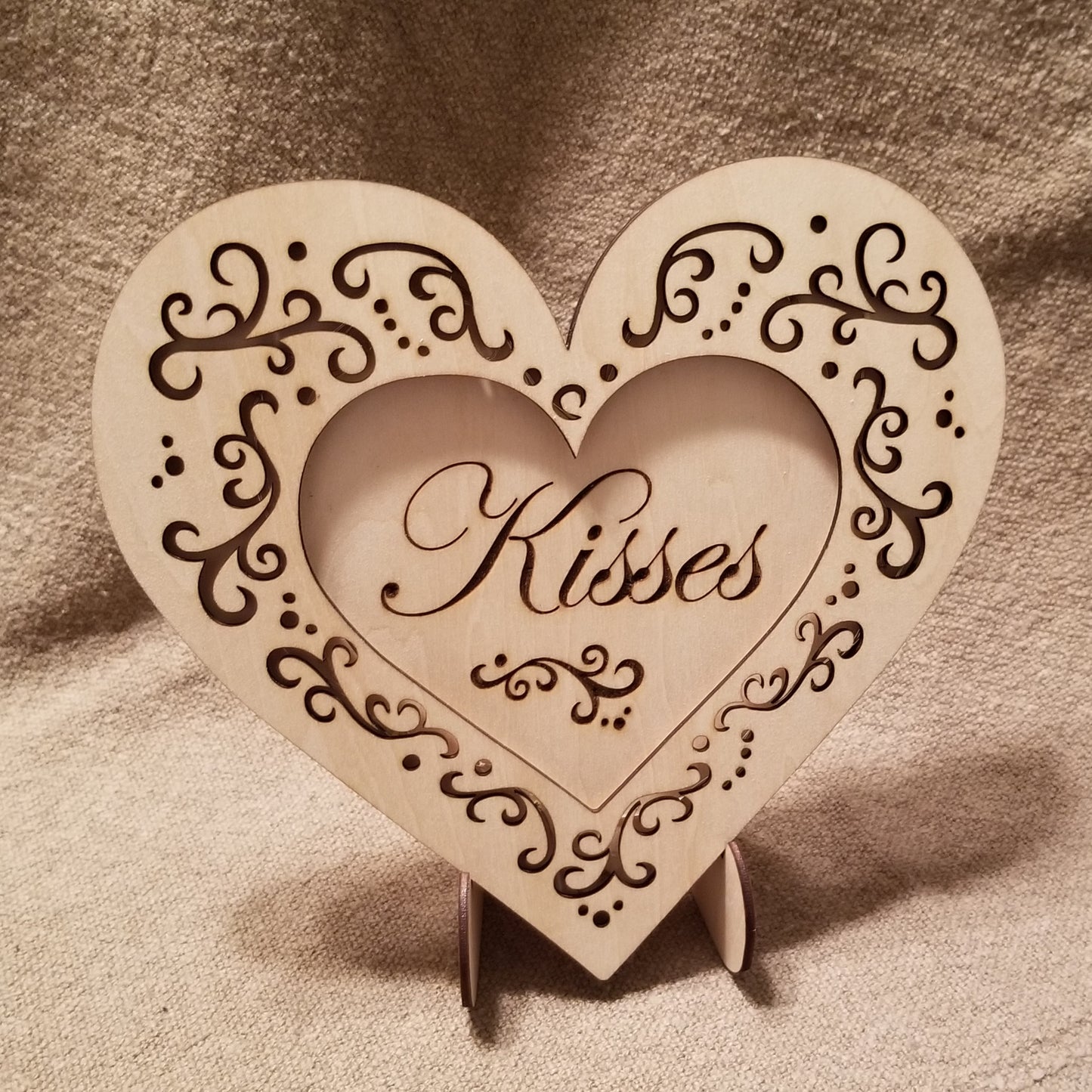 "Kisses" conversation heart with filigree cuts and LED lights. 