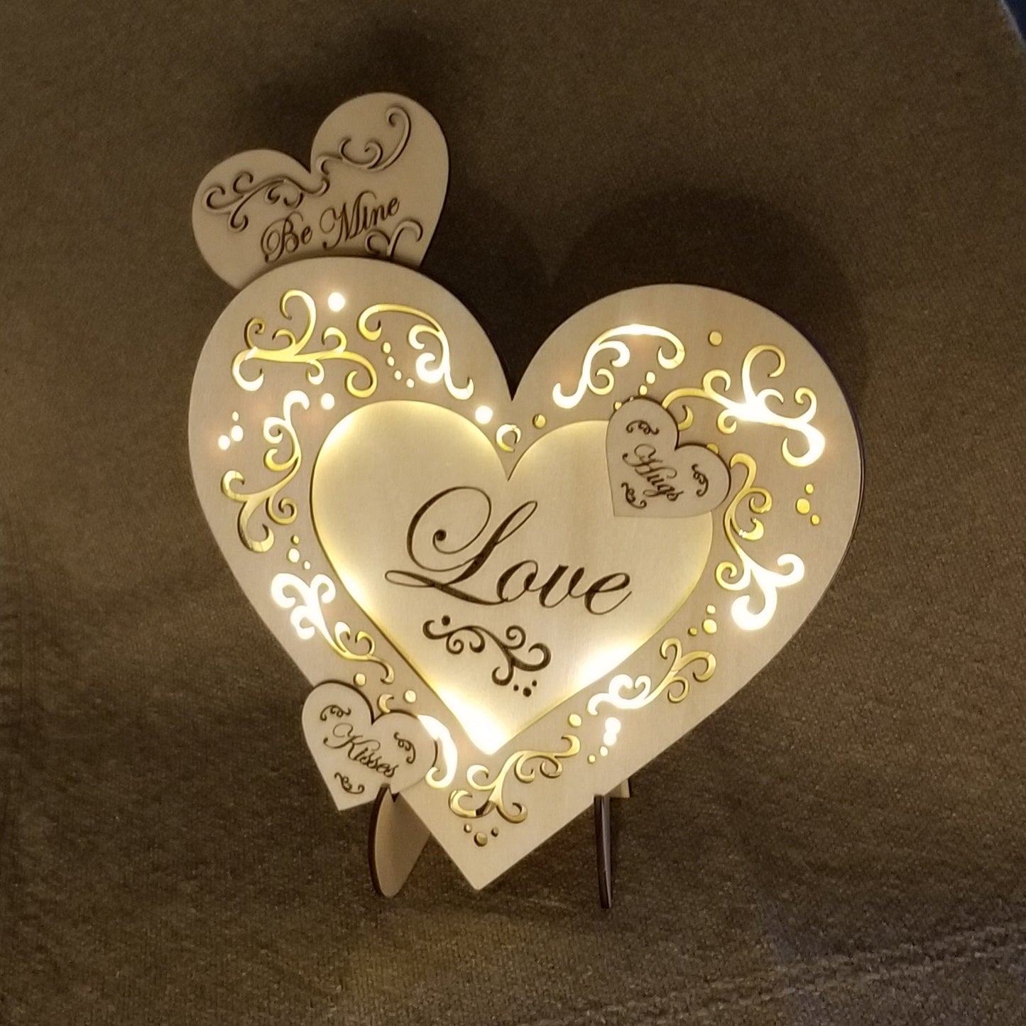 Layered "Love" conversation heart with filigree cuts and LED lights.