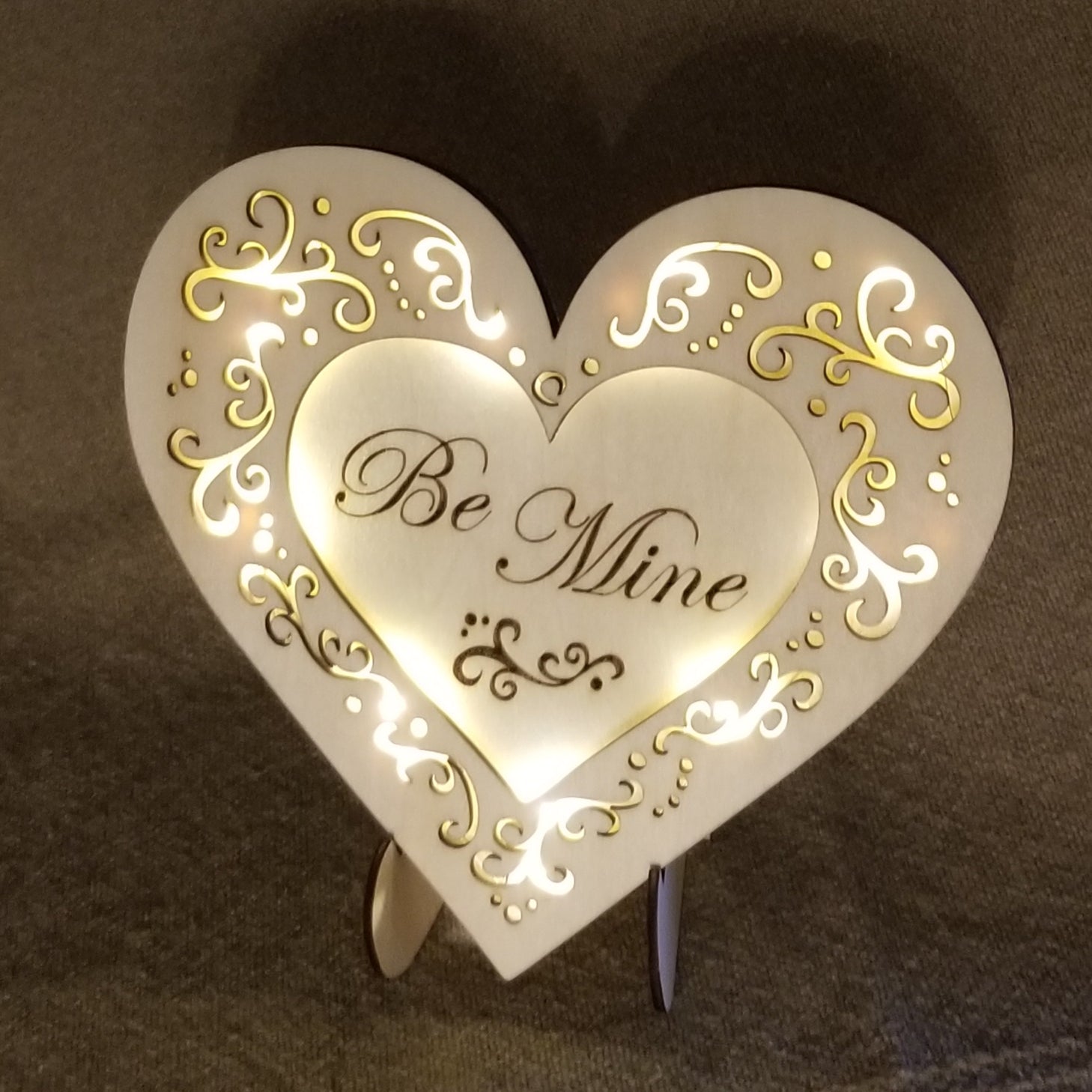 Be Mine conversation heart with filigree cuts and LED lights. 
