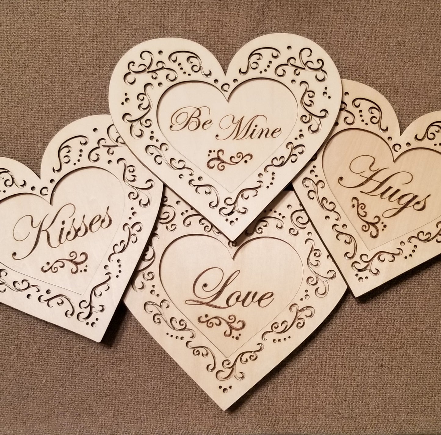 Set of 4 conversation hearts with filigree cuts and LED lights. 