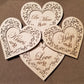 Set of 4 conversation hearts with filigree cuts and LED lights. 