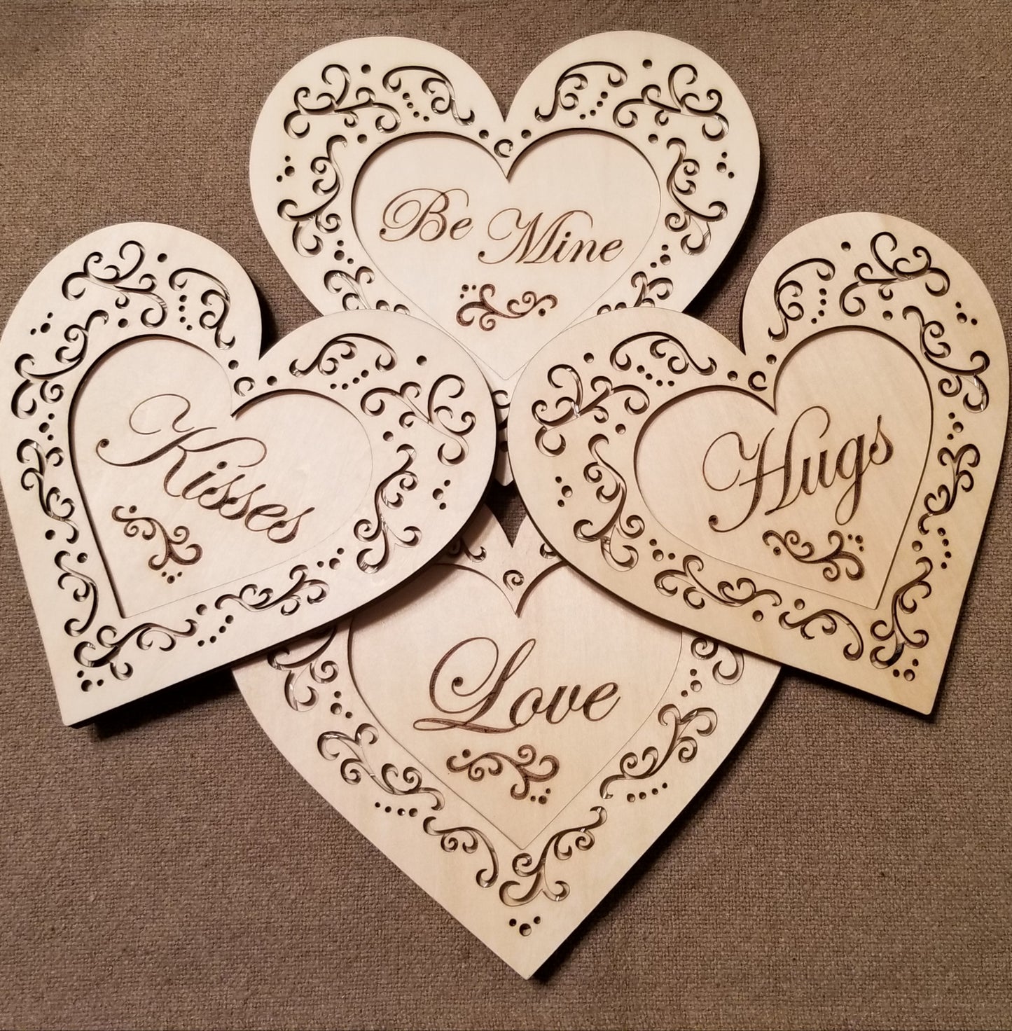 Set of 4 conversation hearts with filigree cuts and LED lights. 