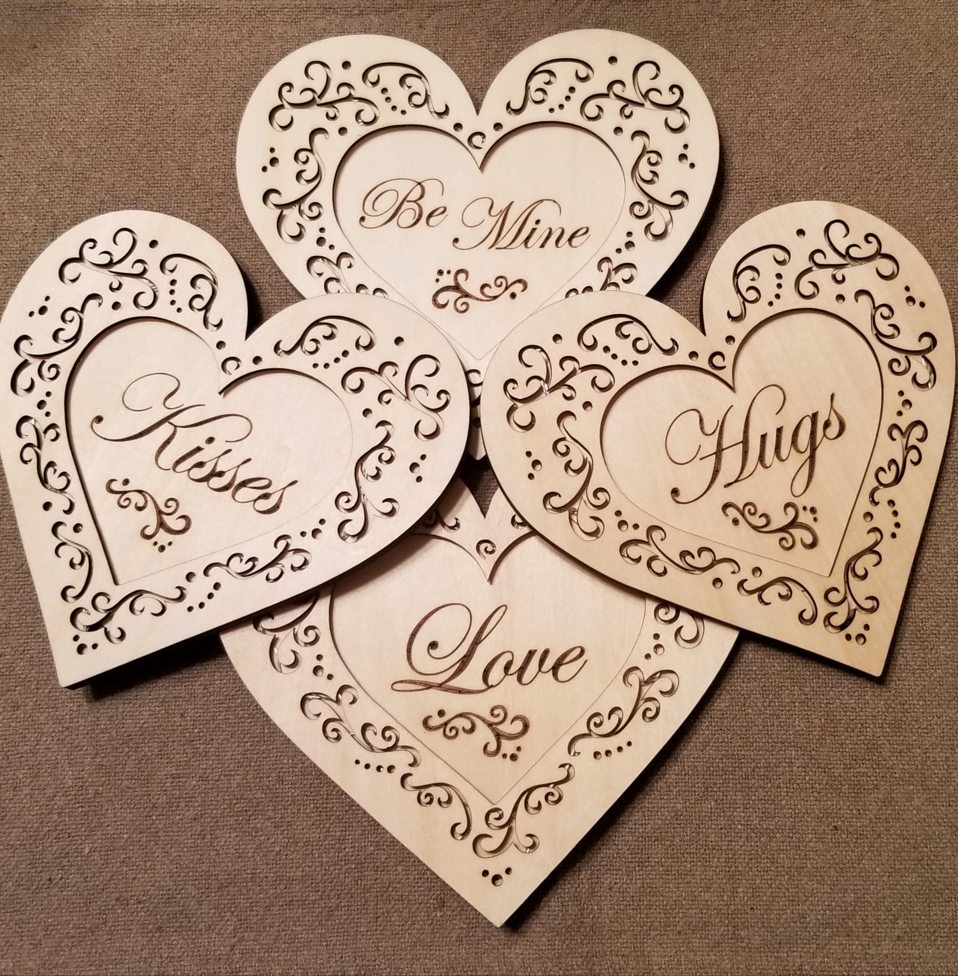 Set of 4 conversation hearts with filigree cuts and LED lights. 