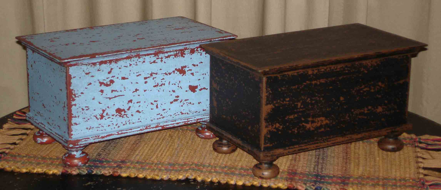 Blue over Red and Black over Brown Wood Bunfoot Keepsake boxes. Handmade in Ohio. Box is hand painted & distressed. Our finish uses layers of color and aging that creates our unique look. Great for small treasures and keepsakes. Use in any room, on a table, mantle or shelf. Compliments design styles including primitive, farmhouse, rustic & traditional. 