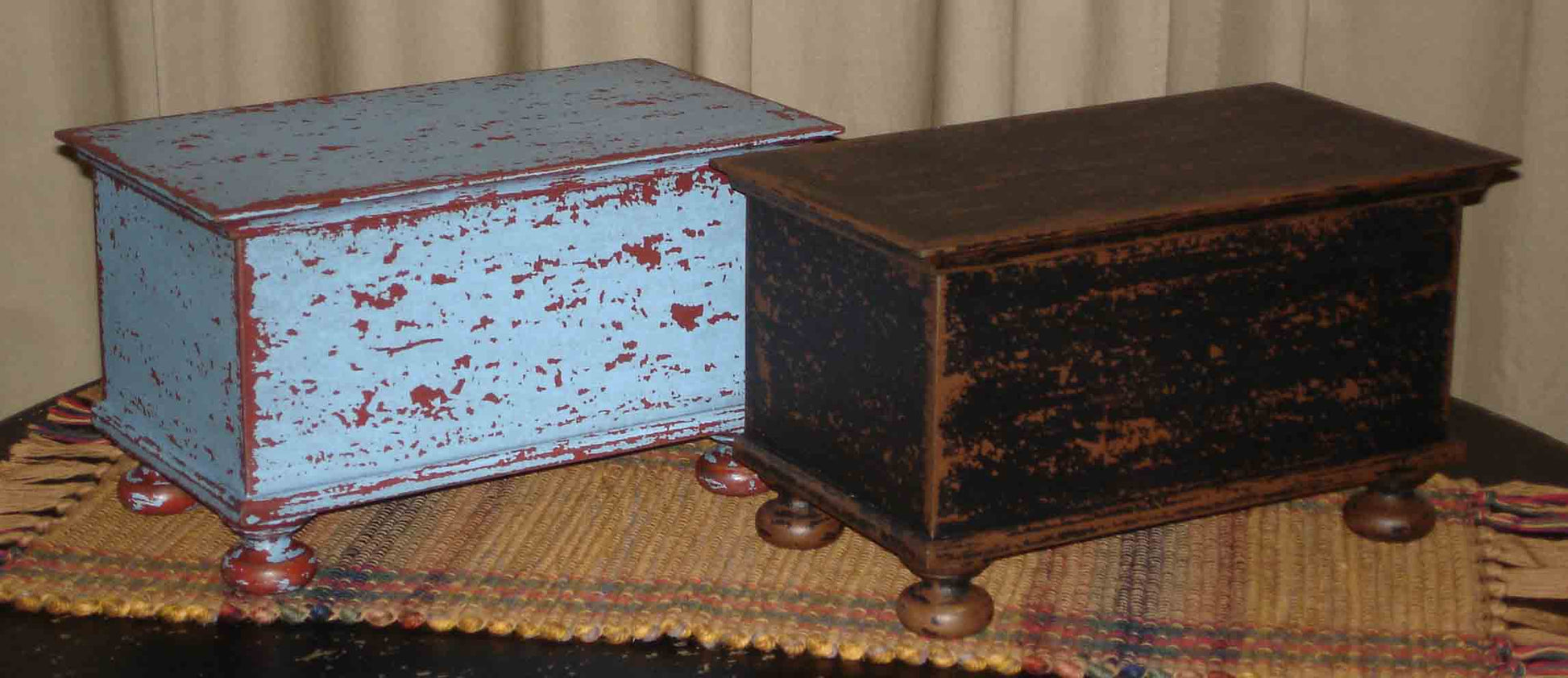 Blue over Red and Black over Brown Wood Bunfoot Keepsake boxes. Handmade in Ohio. Box is hand painted & distressed. Our finish uses layers of color and aging that creates our unique look. Great for small treasures and keepsakes. Use in any room, on a table, mantle or shelf. Compliments design styles including primitive, farmhouse, rustic & traditional. 